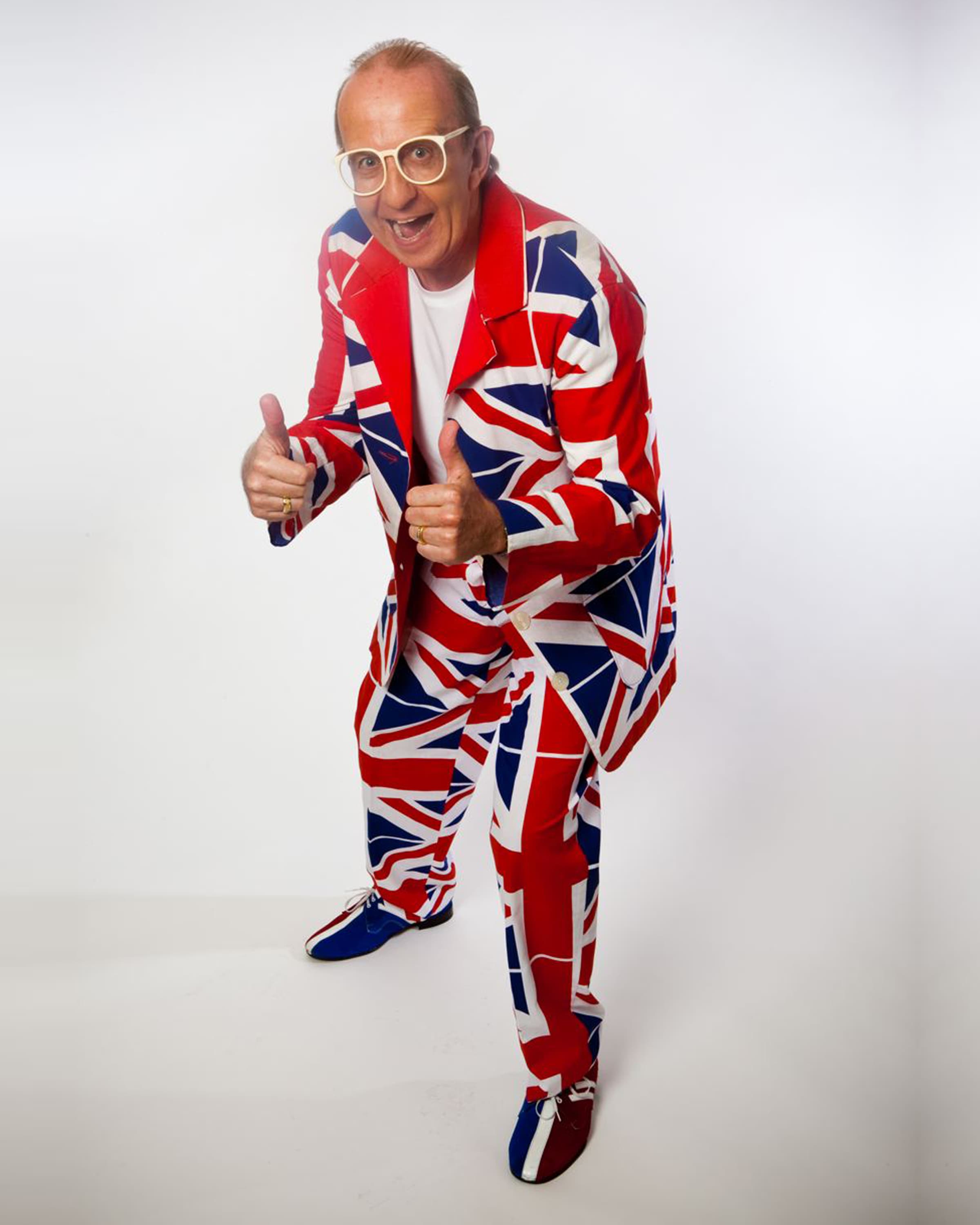 Jimmy Keys in a Union Jack suit giving two thumbs up